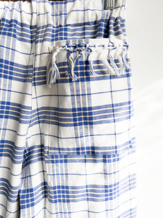 Modré nohavice so strapcami