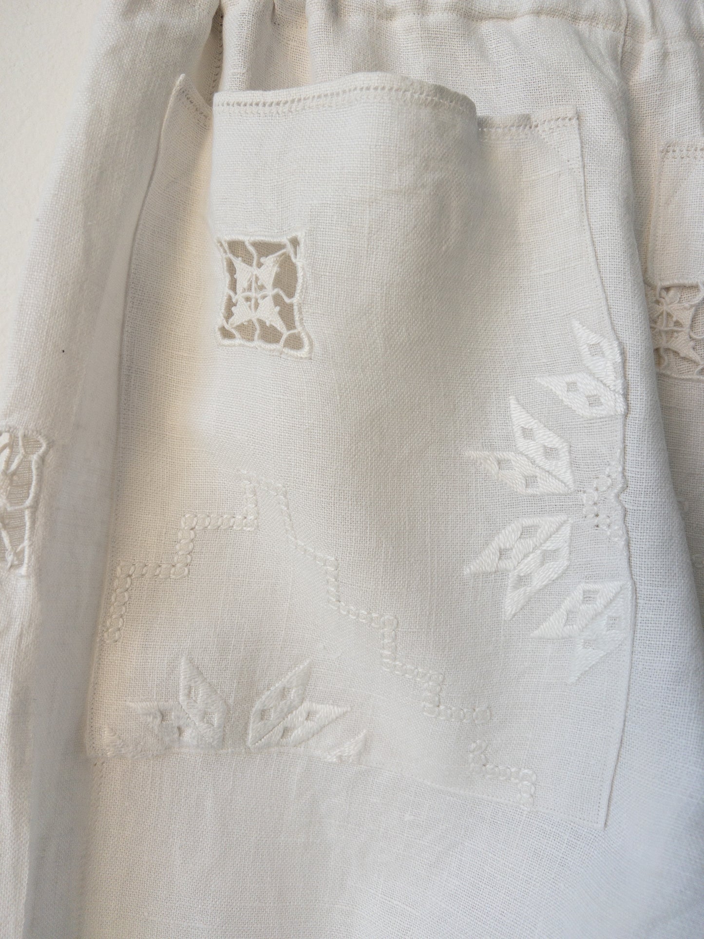 White pants with embroidery