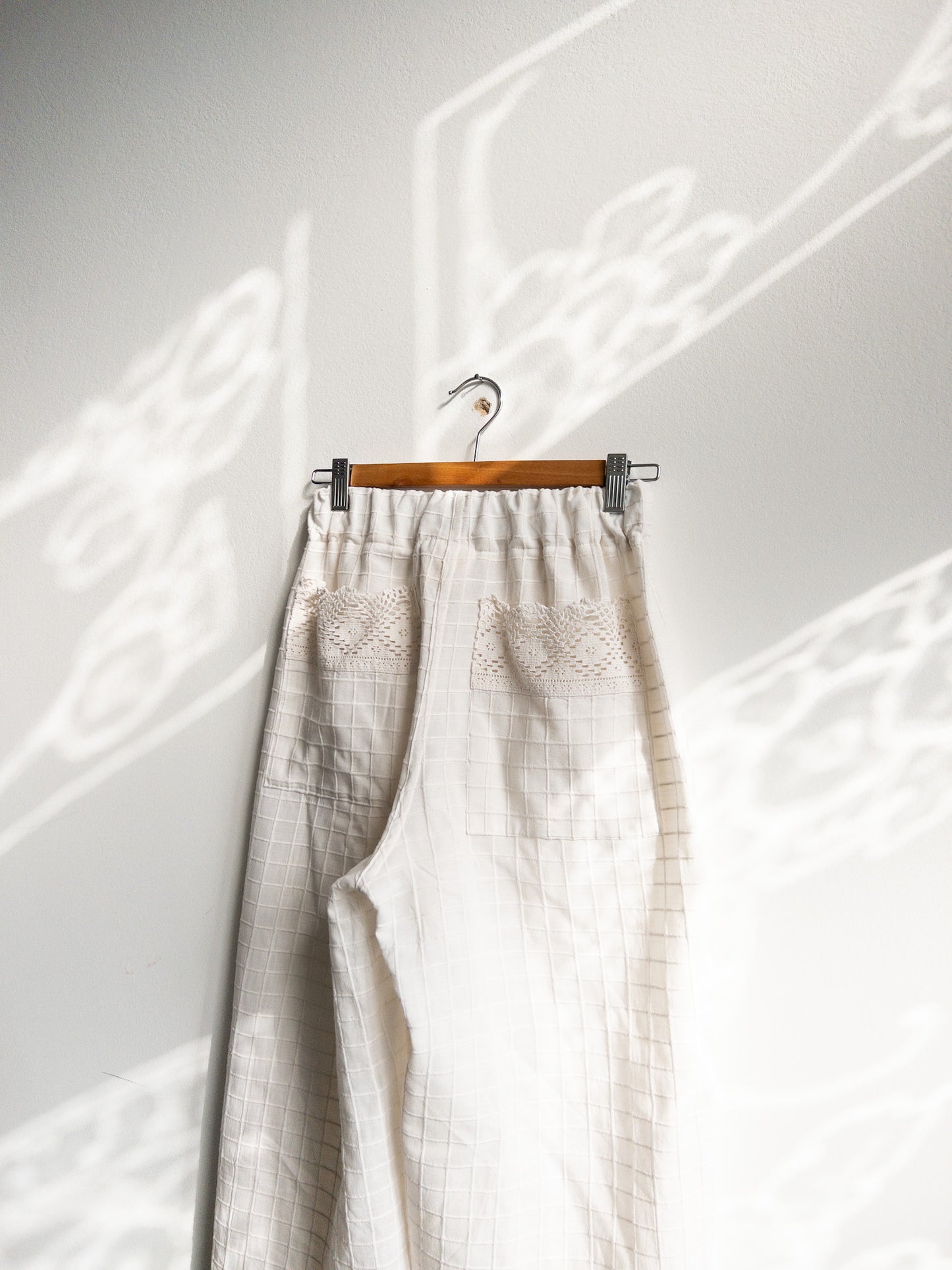 White pants with embroidery