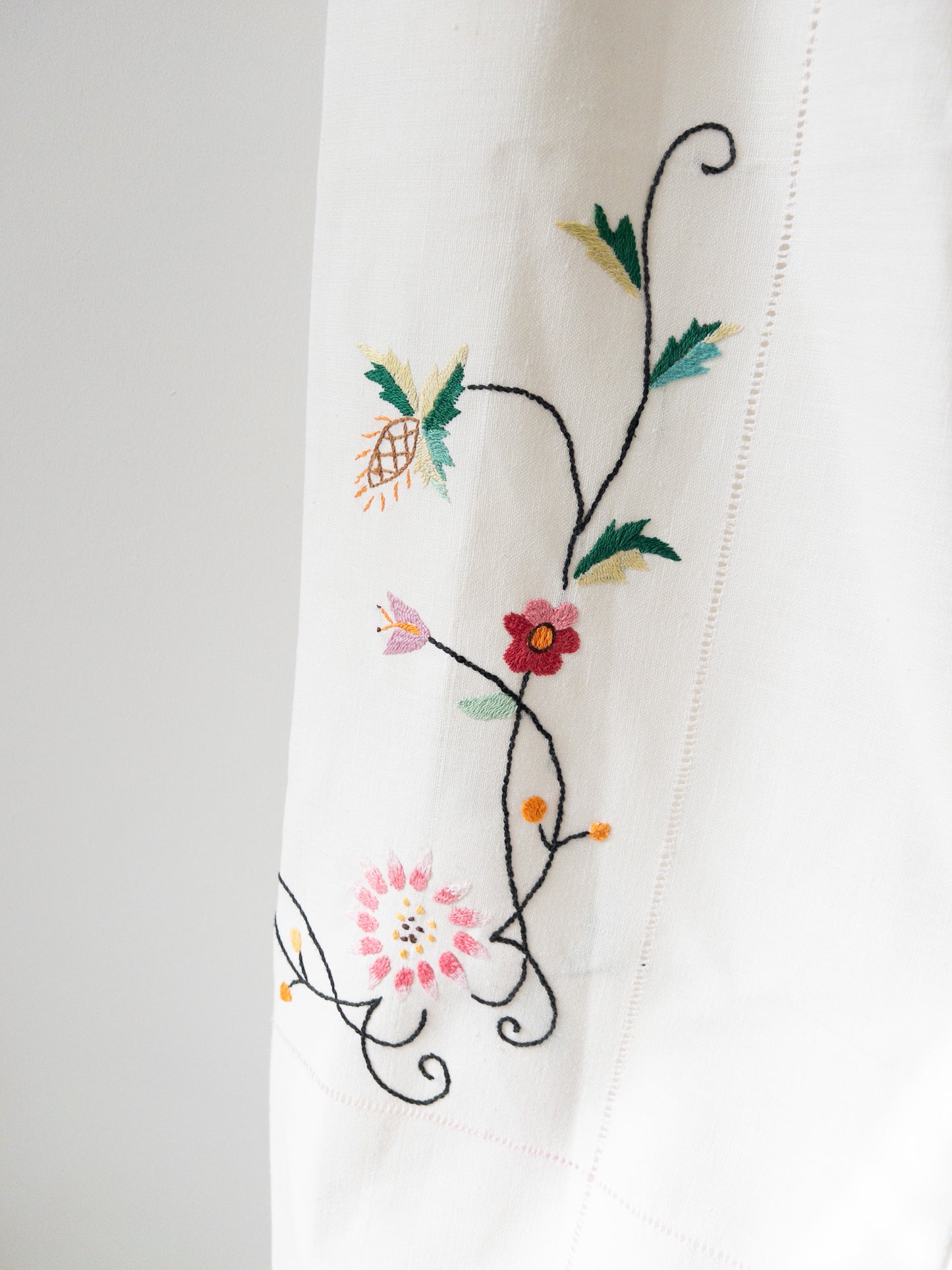 White pants with pink embroidery